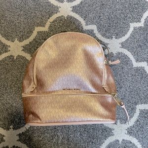 gently used Michael Kors backpack